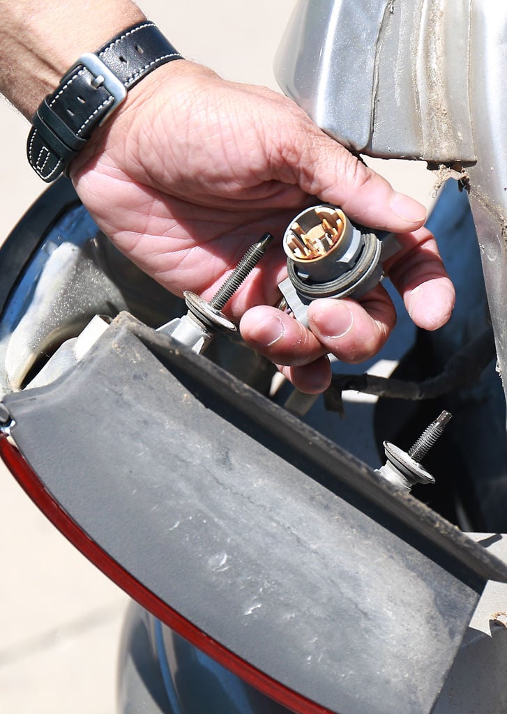 Steve Calloway replaces a brake light bulb